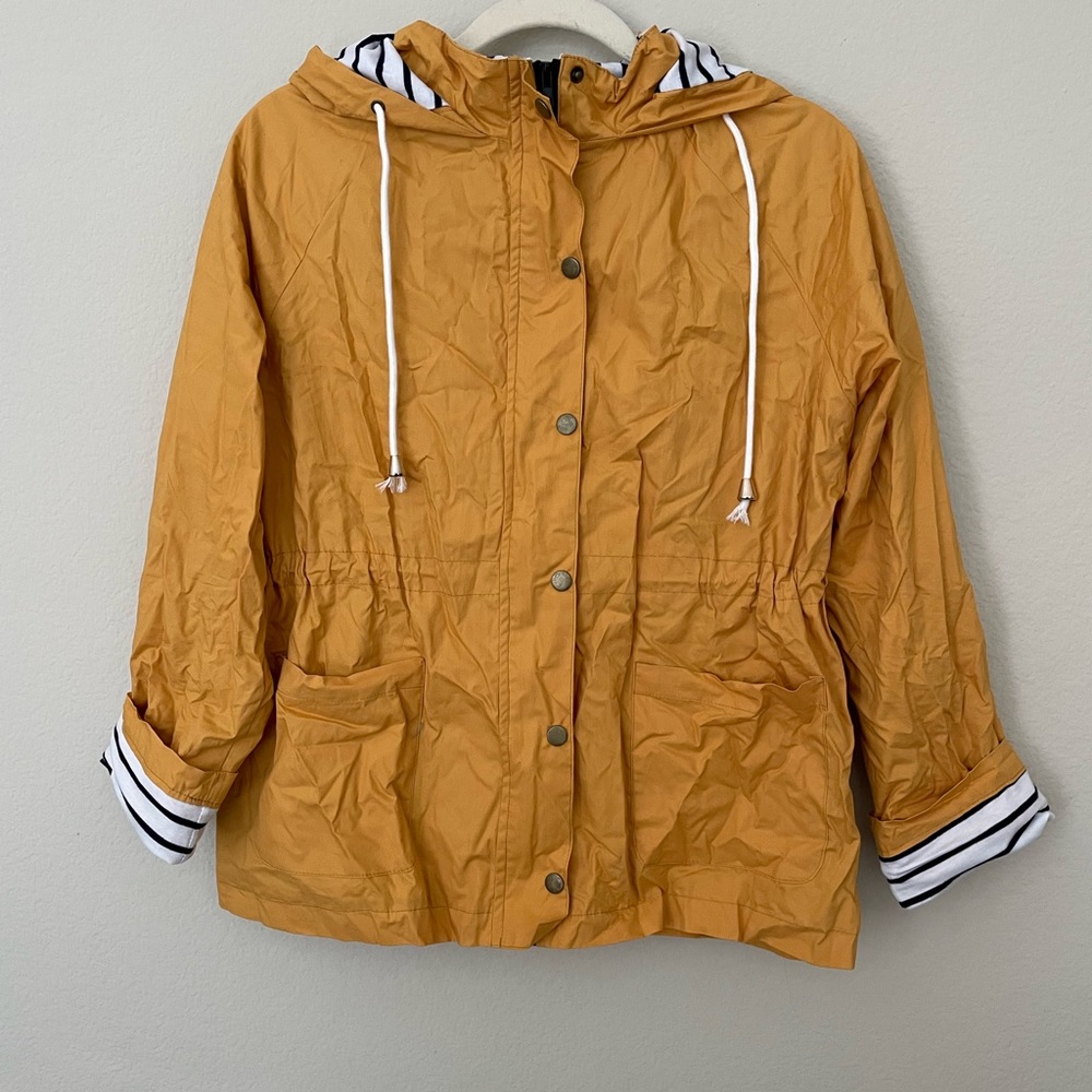 Yellow rain jacket with striped liner